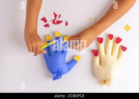 Preschool scissor activities for preschool kids to cut the paper with  scissors to improve motor skills, coordination and develop small muscles  for kin Stock Photo - Alamy