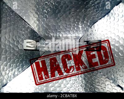 Closeup of a light projector with a red "Hacked" stamp - privacy protection concept Stock Photo