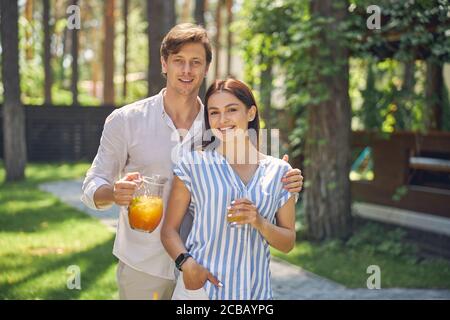 Happy cheerful young people having fun in the outdoors Stock Photo