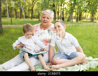 Happy granny with grandsons enjoying time together. Family life Stock Photo