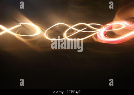 Abstract yellow blur on black. Lights motion effects creative background Stock Photo