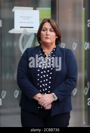 Caroline Donohoe, the widow of Adrian Donohoe, outside the Criminal Courts of Justice, Dublin, where the jury agreed 11-1 in favour of the guilty verdict after 22 hours of deliberation in the Aaron Brady trial for the capital murder of Detective Garda Adrian Donohoe, who was shot dead during a robbery at Lordship Credit Union near Dundalk in January 2013. Stock Photo