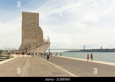 Lisbon, Portugal - 15th May, 2017: Tourists flock around and over the Monument to the Discoveries (Padrão dos Descobrimentos), a monument built of the Stock Photo