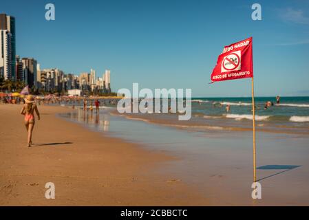 Recife beach with Swimming Forbidden, Risk of Drowning sign, Brazil Stock Photo