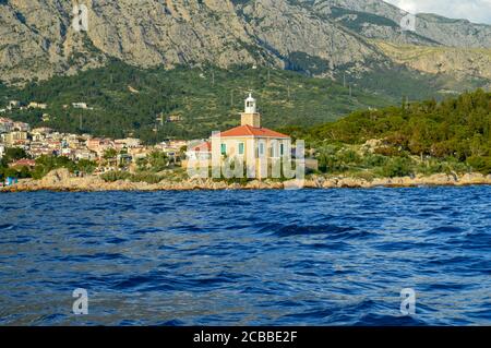 MAKARSKA, CROATIA - JUNE 17: Lighthouse on Makarska riviera beach in Makarska, Croatia on June 17, 2019. Stock Photo