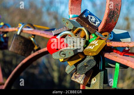 KYIV, UKRAINE - JANUARY 12,2020: Parkovy Bridge with lot of love locks designed by Paton in Kyiv, Ukraine on January 12, 2020. Stock Photo