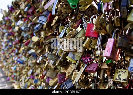 Paris, France,April 2,2017:Close up and selective focus of many love locks, padlocks with names and dates on the Pont-Neuf, Pont de l'Archeveche and Stock Photo