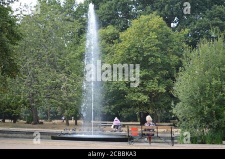 London, UK. 12 August 2020. A water fountain in a pond in Walpole Park on a sunny day. Stock Photo