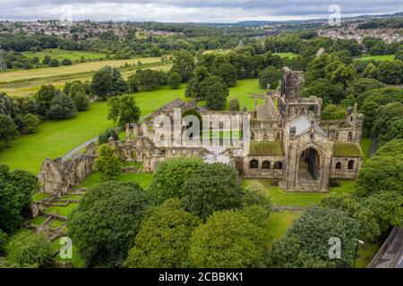 Kirkstall Abbey in Leeds, old ruined abbey surrounded by trees and green countryside in West Yorkshire Stock Photo