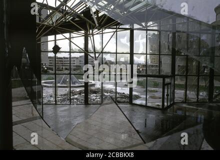 12th April 1994 During the Siege of Sarajevo: shattered windows in part of the Unis Towers complex. Stock Photo