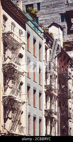 Fire escapes on tenement apartment buildings in Harlem neighborhood ...