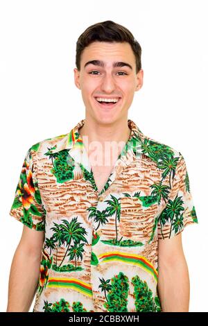 Happy young handsome tourist man with Hawaiian shirt ready for vacation Stock Photo