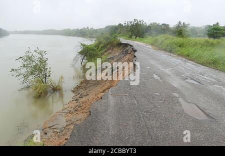 Destroyed Rural Road Rural road destroyed in the middle of high voltage pylons Stock Photo ...
