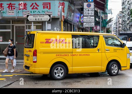 German express delivery mail company DHL van seen parked on the streets of Hong Kong. Stock Photo