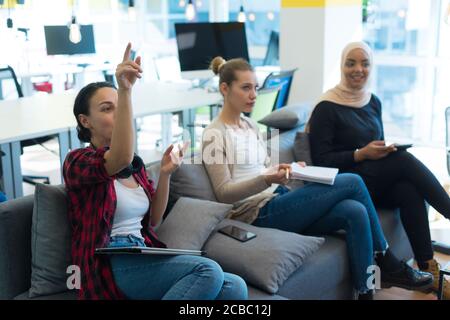 Startup Marketing Idea Presentation. Group of Young multiethnic Coworkers Making Great Business Decisions. Creative Team Discussion Corporate Work Con Stock Photo