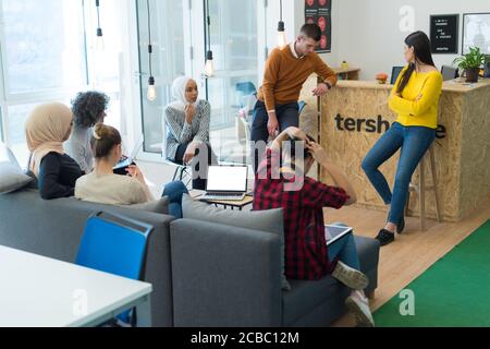 Startup Marketing Idea Presentation. Group of Young multiethnic Coworkers Making Great Business Decisions. Creative Team Discussion Corporate Work Con Stock Photo