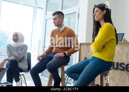 Startup Marketing Idea Presentation. Group of Young multiethnic Coworkers Making Great Business Decisions. Creative Team Discussion Corporate Work Con Stock Photo