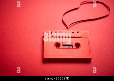 old red cassette tape on a minimalist background Stock Photo