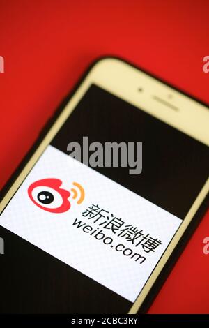 The logo of Sina Weibo/Weibo a Chinese microblogging social media platform on an  iPhone screen Stock Photo