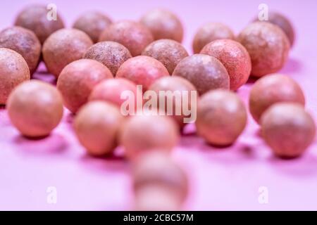 A pile of oranges sitting on top of a wooden table Stock Photo