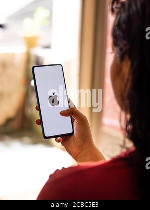 Assam, india - Augest 9, 2020 : Apple logo on phone screen stock image. Stock Photo