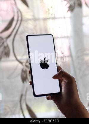 Assam, india - Augest 9, 2020 : Apple logo on phone screen stock image. Stock Photo