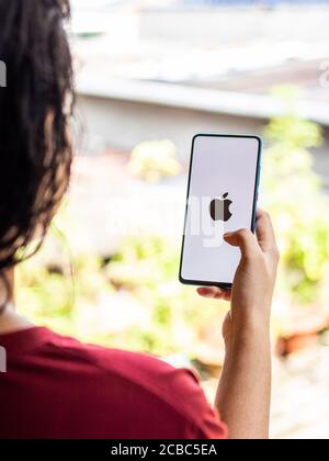 Assam, india - Augest 9, 2020 : Apple logo on phone screen stock image. Stock Photo