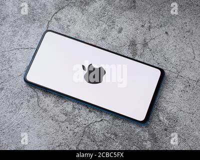 Assam, india - Augest 9, 2020 : Apple logo on phone screen stock image. Stock Photo