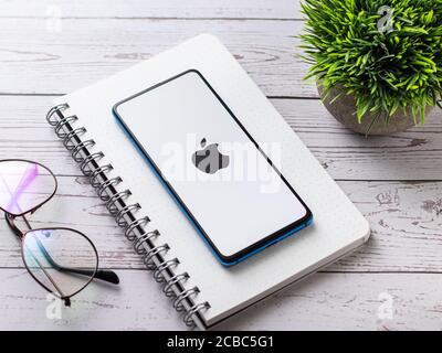 Assam, india - Augest 9, 2020 : Apple logo on phone screen stock image. Stock Photo