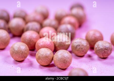 A pile of oranges sitting on top of a wooden table Stock Photo