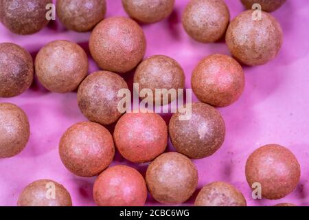 A pile of oranges sitting on top of a wooden table Stock Photo