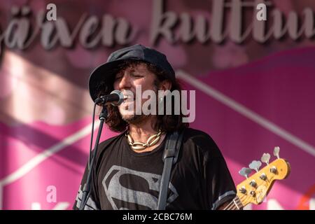 Bassist Sami Yaffa on stage with Michael Monroe, Sami Yaffa and Costello Hautamäki Trio at Krapin Paja open-air concert in tuusula Finalnd Stock Photo