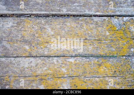 A wooden bench sitting in front of a door Stock Photo