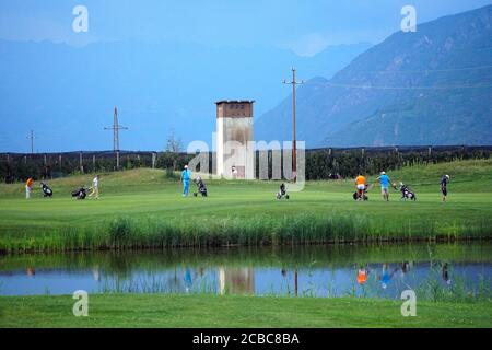 Group of friends - golfers enjoying the game in the Blue Monster Golf Club in South Tirol Italy after COVID-19 lock down on August 11th, 2020. Stock Photo