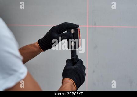Male worker using laser level. Renovation concept Stock Photo