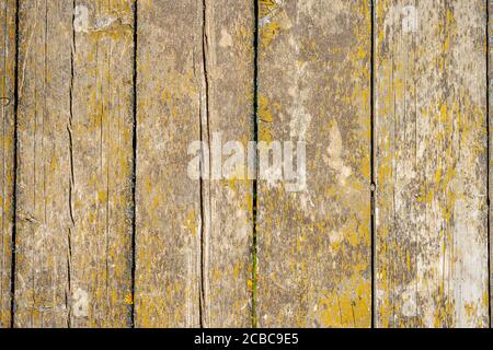 A wooden bench sitting in front of a door Stock Photo