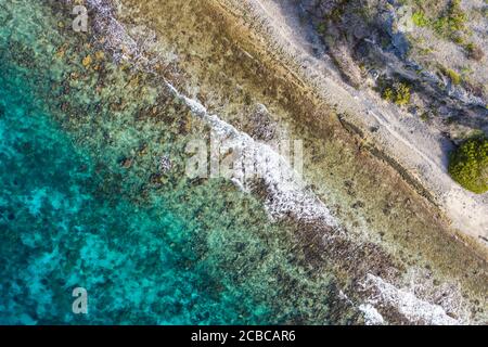 Aerial view of coast of Curaçao in the Caribbean Sea with turquoise water, cliff, beach and beautiful coral reef Stock Photo