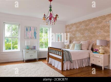 Girl's bedroom with accent wallpaper Stock Photo