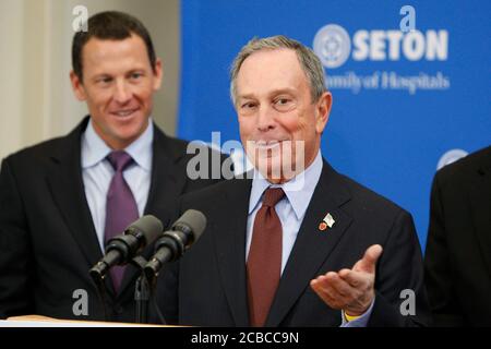 Austin, Texas USA, January 18, 2008: New York City Mayor Michael Bloomberg speaks to reporters about a new cancer health initiative as professional cyclist, cancer survivor and initiative supporter Lance Armstrong listens.  ©Bob Daemmrich Stock Photo