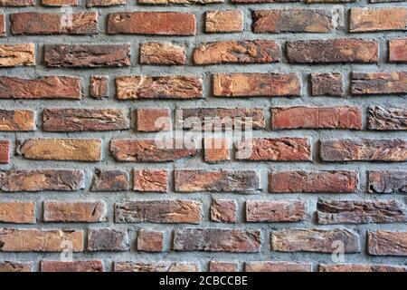 Brick wall dark red colored for background texture, modern retro style Stock Photo