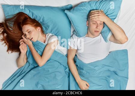 sick young man has headache at night, health problem. close up top view photo. depression Stock Photo
