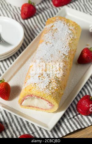 Homemade Frozen Artic Roll Cake with Ice Cream and Strawberries Stock Photo