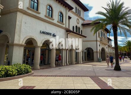 Orlando,FL/USA- 6/13/20:  People shopping and wearing face masks and social distancing at an outdoor mall in Orlando, Florida. Stock Photo
