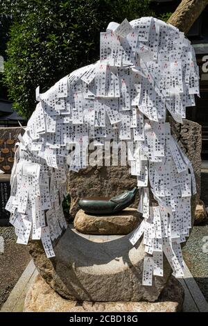 Omikuji Wish Papers at Unpenji - Temple No. 66 on the Shikoku Pilgrimage. Although counted as being in Kagawa Prefecture, it’s actually just across th Stock Photo