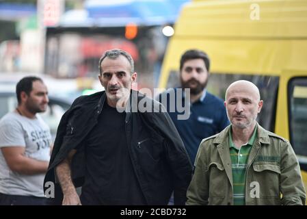 Georgian men in Didube bus station, Tbilisi, Republic of Georgia Stock Photo