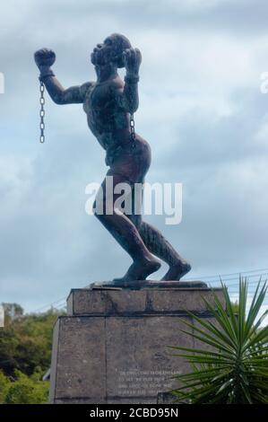 Barbados - January 8, 2012: Emancipation Statue Statue symbolizing the breaking of slavery chains. The inscription says: Lick an Lock-up Done Wid, Hur Stock Photo