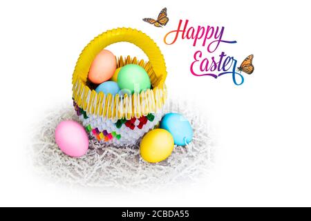 Multi color Easter eggs in an origami paper basket with butterflies and text that says Happy Easter. Isolated on white background with copy space. Stock Photo