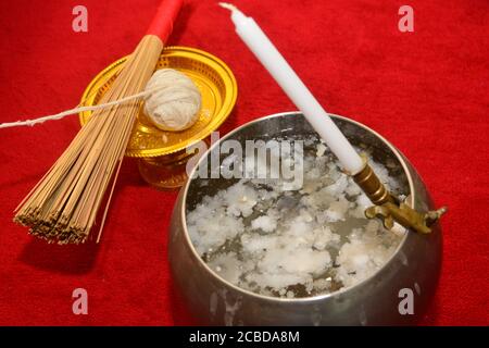 Sacred cord and Holy water in Buddhism Religious Ceremony, note  select focus with shallow depth of field Stock Photo
