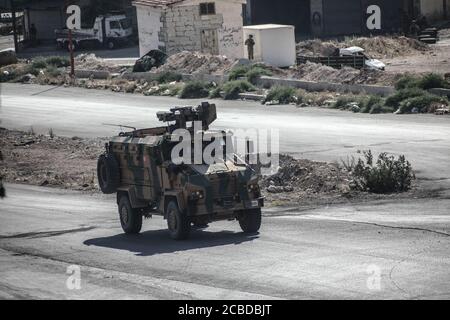 Idlib, Syria. 12th Aug, 2020. The Russian Military and the Turkish military conducted their 24th joint patrol on the M4 highway in the northwestern Syria region of Greater Idlib, on August 12, 2020. The joint patrol set off from the town of Tronba in southern Idlib and reached the town of Ain Hawr in northern Lattakia, completing its entire route. No incidents whatsoever were reported during the patrol. (Photo by Azalden Idlib/INA Photo Agency/Sipa USA) Credit: Sipa USA/Alamy Live News Stock Photo