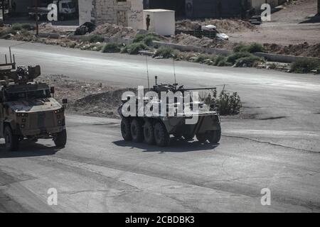 Idlib, Syria. 12th Aug, 2020. The Russian Military and the Turkish military conducted their 24th joint patrol on the M4 highway in the northwestern Syria region of Greater Idlib, on August 12, 2020. The joint patrol set off from the town of Tronba in southern Idlib and reached the town of Ain Hawr in northern Lattakia, completing its entire route. No incidents whatsoever were reported during the patrol. (Photo by Azalden Idlib/INA Photo Agency/Sipa USA) Credit: Sipa USA/Alamy Live News Stock Photo